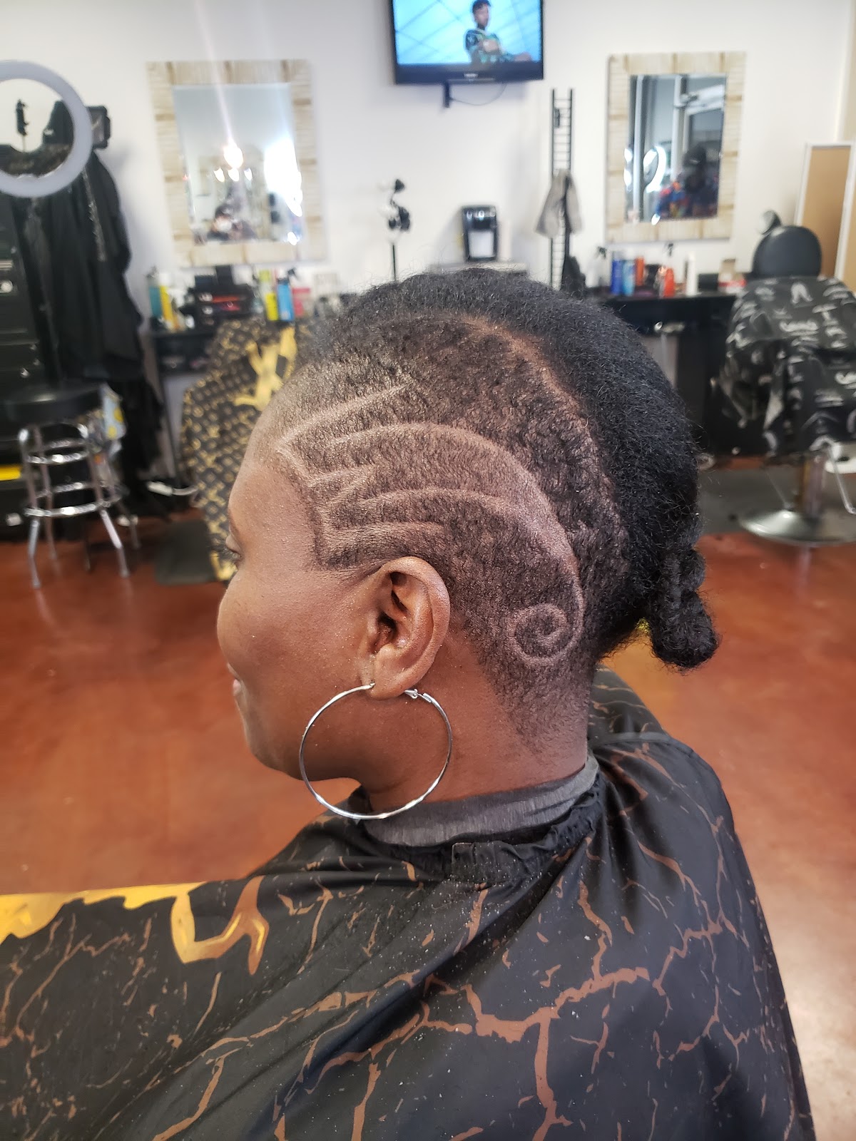 Custom hair design with a swirl pattern, side profile