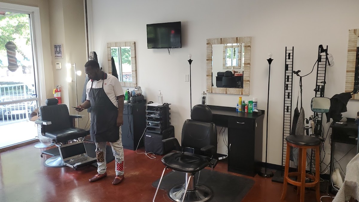 Inside Tony Black Barbershop — barber chairs, mirrors and a clean, easygoing floor